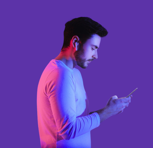 man smiling at his phone