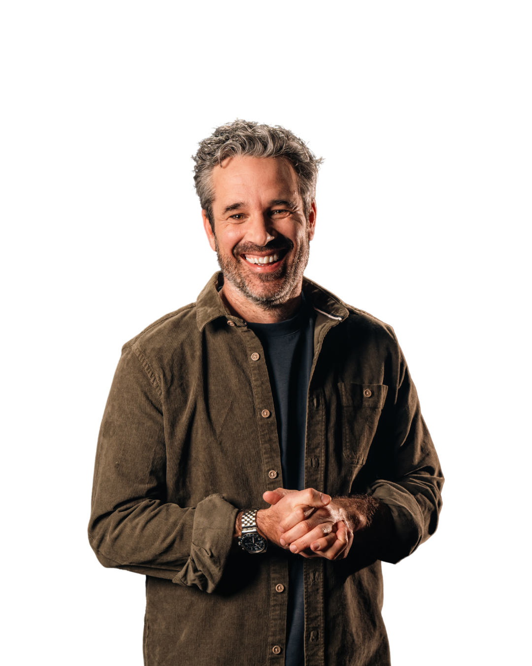 a smiling man with hands clasped